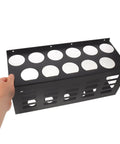 Badass Wall Mounted Caulk Tube Organizer Rack With 11 Hella Durable Slots being held, showing sleek black metal design and storage capacity.