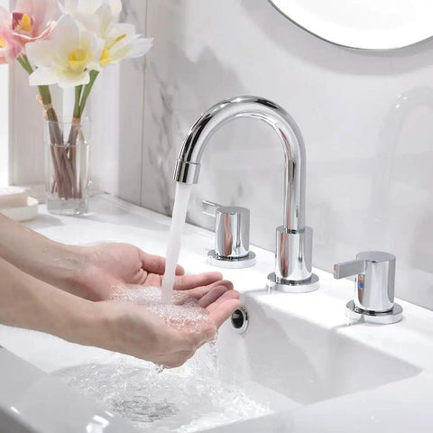Person washing hands using Chrome Finish Widespread Bathroom Sink Faucet With 8 Inch Spread For 3 Hole Vanities