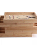 Natural Bamboo And Wood Jewelry Tray Pretty Slick Display Plate For Rings Necklaces And Bracelets Solid Build Smooth Surface Easy Wipe Bedroom Vanity Organizer with stacked trays holding jewelry.