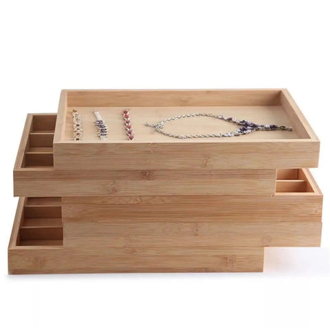Natural Bamboo And Wood Jewelry Tray Pretty Slick Display Plate For Rings Necklaces And Bracelets Solid Build Smooth Surface Easy Wipe Bedroom Vanity Organizer with stacked trays holding jewelry.