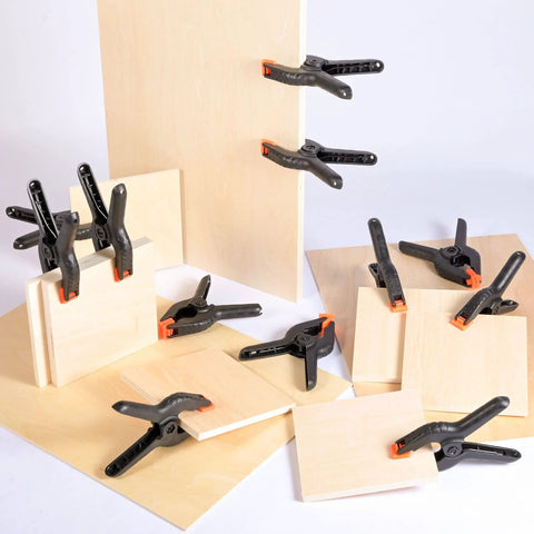 Twenty 3.5-inch plastic spring clamps, black with orange tips, for crafts, woodworking and photography