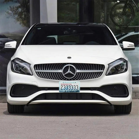 Front view of a white car with "Two Pack Stainless Steel License Plate Frame Set With Screw Caps And Screwdriver Set For 2 Hole Plates Durable Adventure Themed Cover That Will Not Fade Weatherproof And Easy To Install For Women And Everyday Riders".