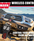 Truck with Wireless Remote Winch Control System For Trucks And SUVs With Transmitter And Receiver fitted for off-road use.