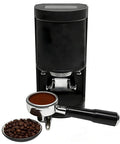 Top Shelf Electric Coffee Tamper With Smart Auto Sensor And Tough Stainless Steel Build For Spot On Espresso Pressure And Next Level Daily Grinds At Home Or Local Cafe with black stainless steel body and coffee grounds.