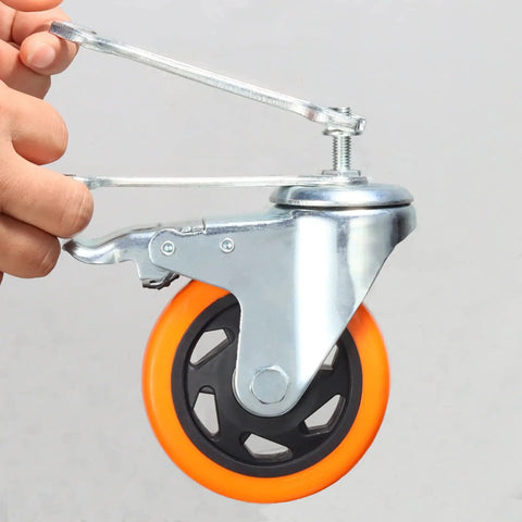 Hella Smooth 4 Inch PVC Stem Caster Wheels With Dual Locking Brake held in hand, featuring orange wheel and metal frame.
