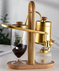 Top Shelf Belgian Siphon Coffee Maker With Stunning Gold Finish Built From Heavy Glass And Steel Frame Relies On Steam Heat And Gravity Action To Pull Silky Smooth Brews Fast Sick Flex For True Coffee Geeks Wanting Elite Taste At Home Or Work with borosilicate glass and wooden base.