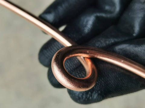 Close-up of Soft Annealed Copper Bonded Ground Wire 4 AWG 50 Feet Coil, showing copper finish and looped detail