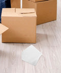 White EPE Foam Shipping Bags For Bottles And Ceramics on floor with cardboard boxes for moving