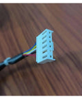 Close-up of connector for 20W Brushless DC Fan Motor For Air Conditioner WZDK2038G, showing colored wires for clarity.