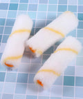 Three slick high density foam covers from the Twenty Piece Mini Paint Roller Kit featuring yellow stripes for precise wall jobs.