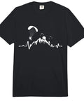 Heartbeat Powered Paragliding Paraglider Tee For Motor Paraglider Crew Heavyweight Relaxed Fit Adult Shirt With Soft Washed Fabric And Bold Paramotor Design featuring a paraglider and mountain graphic.