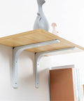 Heavy Duty Metal Wall Mounted Floating Shelf Brackets Set Of Two Knockout Rust Resistant White Supports For No Fuss Wall Decor And Rock Solid Furniture Fixes with wooden shelf and decor.
