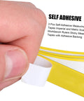 Close-up of a hand peeling a self-adhesive measuring tape from a roll, showcasing the Peel And Stick Measuring Tape Ruler With Double Scale Metric And Imperial Marks Solid For Router Tables And Craft Tasks Clear Numbers That Get The Job Done Quick Pack Of Three Forty Inch Adhesive Strips You Gotta Keep On Deck For Shop Projects.