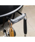 Close-up of handle and hook on Original Kettle Premium Charcoal Grill 22 Inch Black Outdoor BBQ Grill With Built In Thermometer