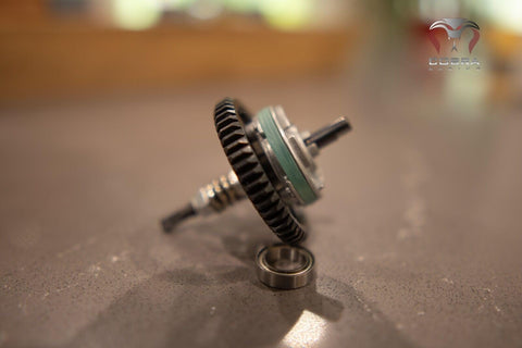 Close-up of 4x4 RC Upgrade Kit: 54T Metal Spur Gear 32P With Full Clutch Assembly for Slash Rustler 4WD on a table.
