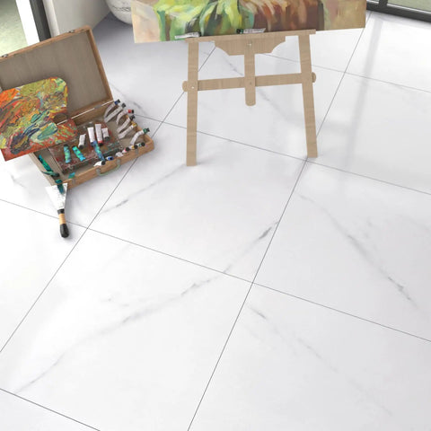 Peel And Stick White Marble Vinyl Floor Tiles 12x12 Inch 1mm Thick Waterproof Self Adhesive Flooring For Bathroom Kitchen Bedroom And Camper, 20 Tiles Cover 20 Sq Ft, Easy Install No Mess in an artist's studio with paint and easel.