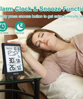 Wireless Indoor Outdoor Thermometer Weather Station With Clock displayed on bedside table next to sleeping person.
