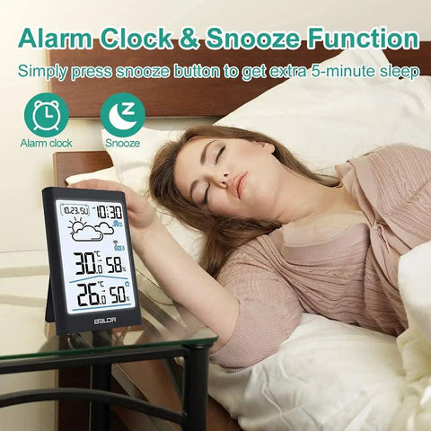 Wireless Indoor Outdoor Thermometer Weather Station With Clock displayed on bedside table next to sleeping person.