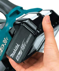 Top Tier Heavy Hitter 36V Brushless Leaf Blower Kit With Dual 18V Batteries showing 5.0Ah lithium-ion battery in hand.
