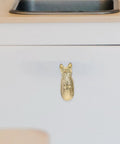 Real Deal Brass Animal Head Cabinet Knobs With Sweet Golden Finish Durable Drawer Pulls For Wardrobes Cupboards Easy Install Furniture Setup on white drawer.