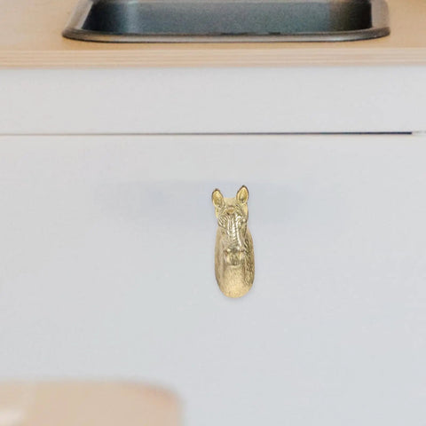 Real Deal Brass Animal Head Cabinet Knobs With Sweet Golden Finish Durable Drawer Pulls For Wardrobes Cupboards Easy Install Furniture Setup on white drawer.
