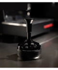 Straight Up 58mm Espresso Distributor Tool For Solid Portafilter Bed Leveling With Heavy Duty Stainless Steel Build Effortless Cleaning And Hella Smooth Extraction For Pro Home Baristas on a countertop.
