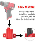 Diagram showing installation of 2 In 1 Wall Mount Tool And Battery Holder For Milwaukee M12 12V with drill, hanger, and mounting guide.