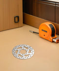 120mm 6-Bolt Stainless Steel Brake Rotor for Electric Scooters and Mountain Bikes, hollow design on a workbench
