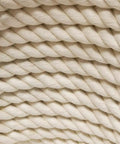 Close-up of One Half Inch Natural Twisted Cotton Rope thick and soft dope for macrame, decor, crafts, camping, and DIY projects. Beige color.
