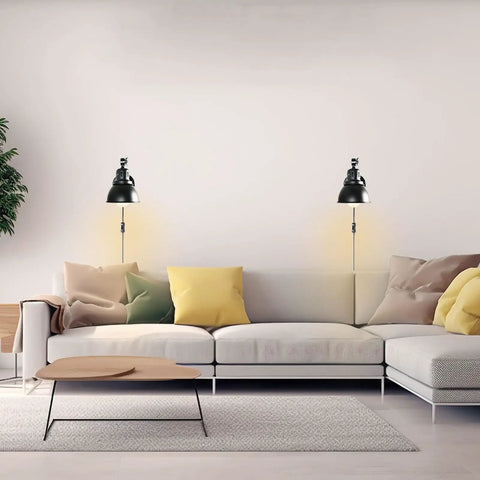 Set Of 2 Black Plug In Wall Sconces Industrial Style With On Off Cord Switch lighting above a modern sofa in a cozy living room.