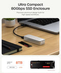 Rad Speed 80Gbps NVMe SSD Enclosure With Direct Hook Up USB4 V2 Connector and active cooling on a workspace with a laptop.
