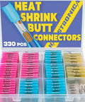 Transparent plastic case containing 330 heat-shrink butt connectors in pink, blue, and beige