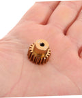 5 Piece Top Shelf Iron Reduction Gear Kit For Climbing Car Motors Featuring Hardcore Heavy Duty Cogs and Slick Precision Drive Stable Replacement Parts For Tough Rc Trucks, golden gear in hand.