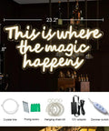 This Is Where The Magic Happens Neon Sign For Wall Decor with accessories, shown on dimly lit wall, 23.2x11.8 inches, warm white light.