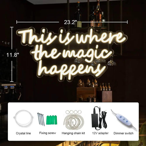 This Is Where The Magic Happens Neon Sign For Wall Decor with accessories, shown on dimly lit wall, 23.2x11.8 inches, warm white light.