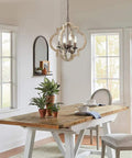 Dining room with Handmade Wood Farmhouse Orb Chandelier With Four Lights, Openwork Quatrefoil Frame, Distressed Brown Wood And Bronze Rust Arms.