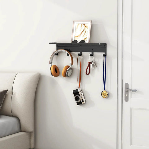 Wall Mounted Shelf With Five Metal Hooks, 17 Inch Coat Rack Organizer For Entryway, Black Finish on wall with items hanging