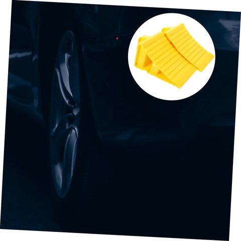 2 Pack Heavy Duty Rubber Wheel Chocks on a driveway, designed for stable vehicle blocking and quick moisture shedding.
