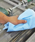 Prep Wipe Lint Free Towels Heavy Duty Cloths For Household And Industrial Use Disposable Rags Nonwoven Wipes 300 Pack 9 By 17 Inches Blue Ultra Low Lint For Painting Prep And Tough Cleaning Jobs being used to clean a metal surface