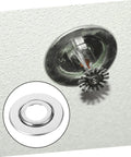 20 Pieces Stainless Steel Fire Sprinkler Escutcheon Plates Expandable Protective Caps on a ceiling with sprinkler head.