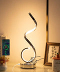 Modern Spiral LED Table Lamp With Dimmable Touch Control And USB Port 22W Reading Light on a desk with decor and phone charging
