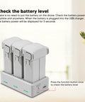 Three Port Drone Battery Charger Station For Mini 3 Pro And Mini with three batteries inserted, showing battery levels.