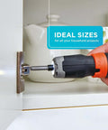 Side view of cordless screwdriver with orange collar driving a screw into a cabinet hinge.