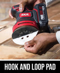 Person attaching sandpaper to PWRCore 20 Brushless 20V 5-Inch Random Orbital Sander With 2.0Ah Battery And PWRJump Charger