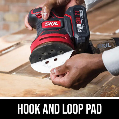Person attaching sandpaper to PWRCore 20 Brushless 20V 5-Inch Random Orbital Sander With 2.0Ah Battery And PWRJump Charger