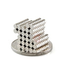 Tiny 3x1.5mm Neodymium Disc Magnets Pack Of 300 For Warhammer And Miniatures stacked on coin