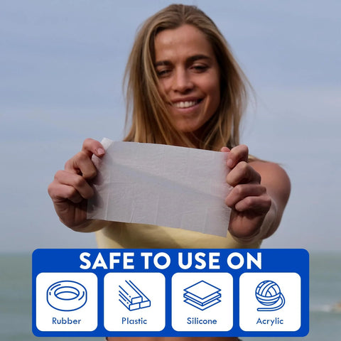 Hearing aid cleaning wipe held by woman; white towelette with rubber, plastic, silicone, acrylic icons.