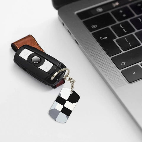 Heavy Duty Aluminum Keychain With Black And White Piano Plate Grid Print Rectangular Steel Keyring Built Tight For Everyday Carry Clean Aesthetic Daily Driver Gift Ready attached to a car key by laptop