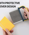 Stainless steel crinkle cutter with blue and yellow handle and yellow protective case, angled front view