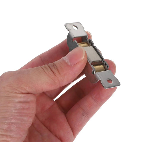 Tight Stainless Steel Sliding Door Rollers Engineered For Dead Quiet Glide Action On Modern Glass Tracks With Heavy Duty Bearings, held in hand.